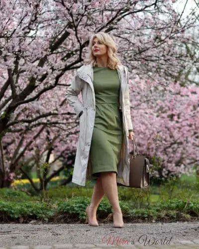 Woman in spring outfit with blooming trees