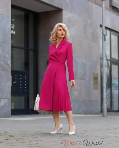 Woman in pink dress and white heels.